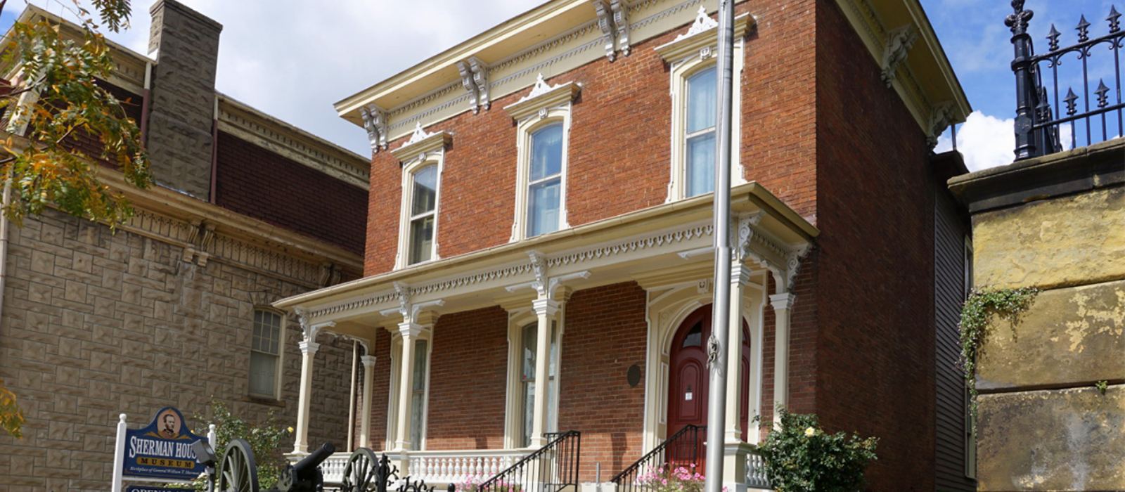 The Sherman House from the side, showing the original 1811 frame home beside the later brick front